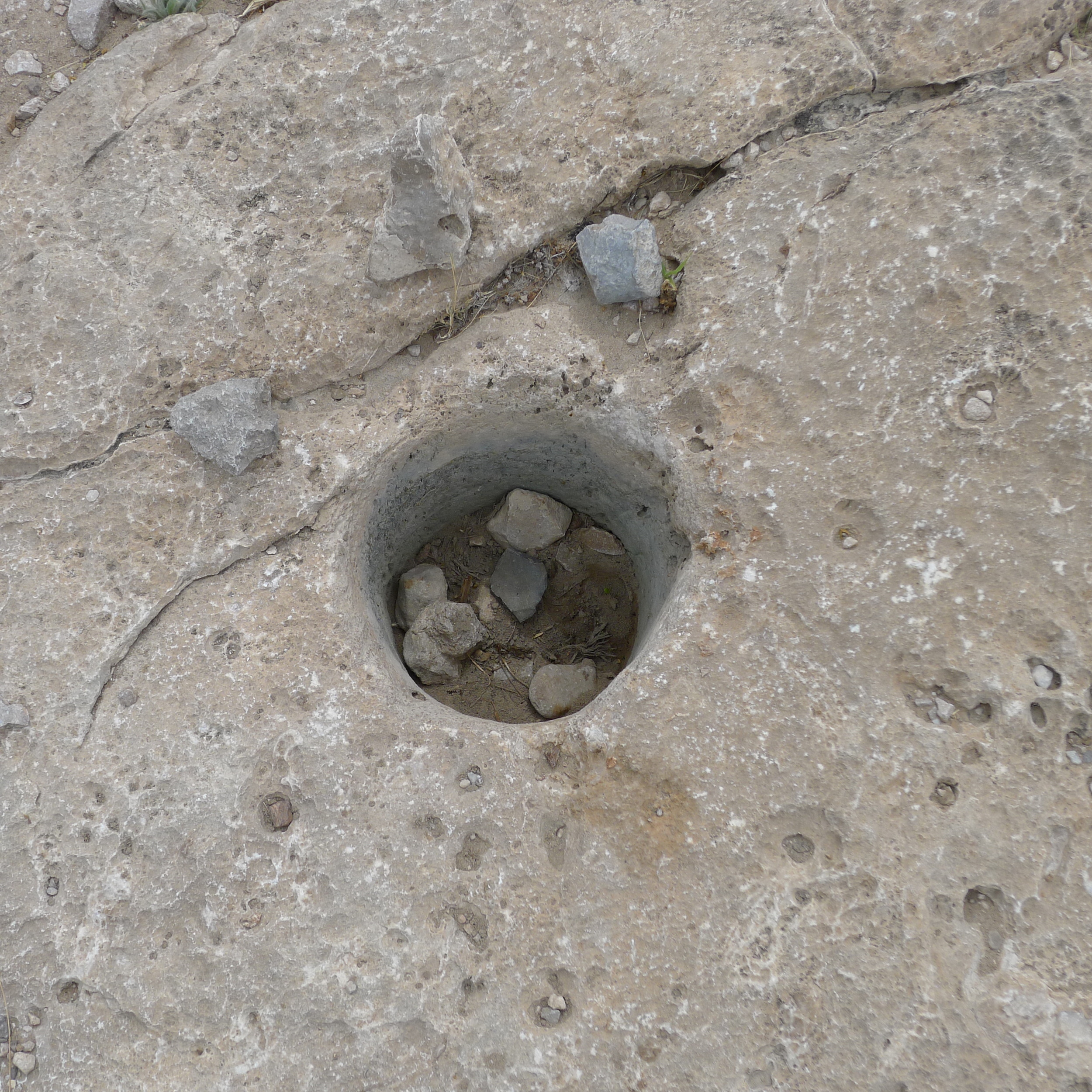 Ancient Indian food grinding hole.